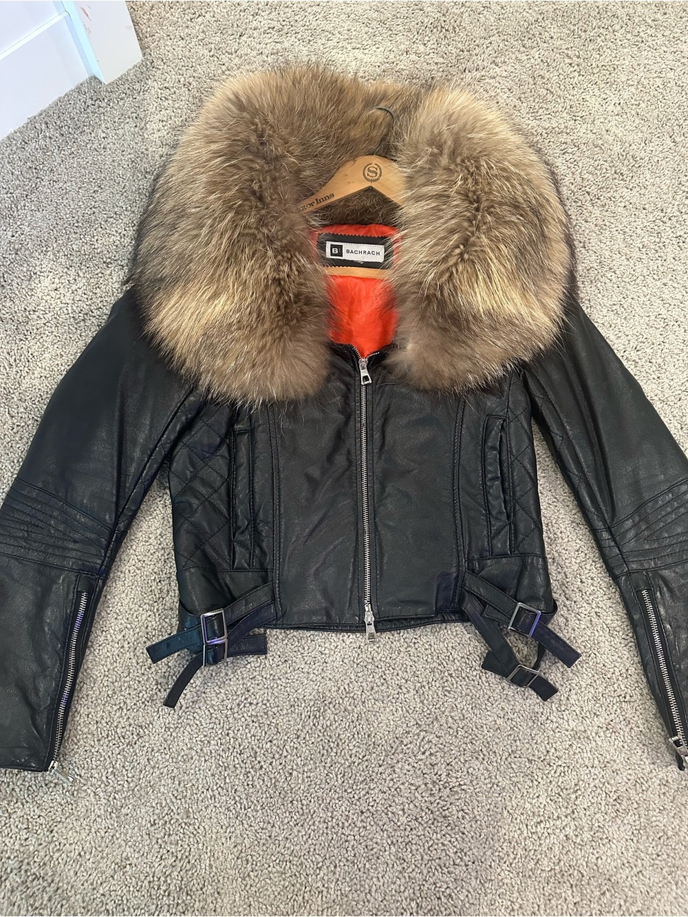 Black leather biker jacket with fox fur
